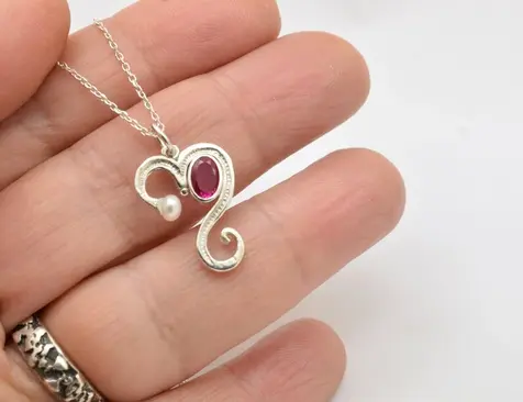 Heart silver necklace with ruby color cz ασημένια καρδιά με οβάλ ζιργκόν σε ασήμι 925