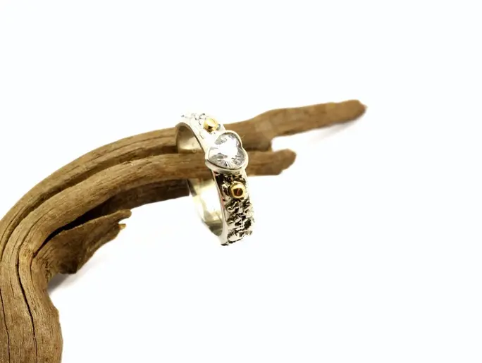 Sturdy ring handmade from sterling silver with cubic zirconia heart and 14k gold accents