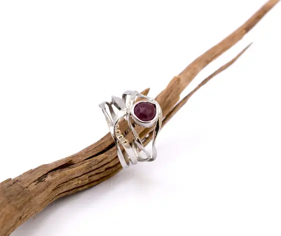 Sterling silver wrap band ring with faceted ruby gemstone