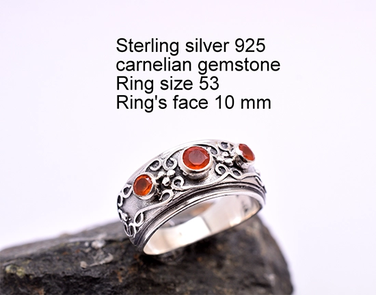 Handcrafted sterling silver ring with three carnelian gemstones.