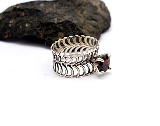Handcrafted sterling silver garnet ring with 8mm deep red gemstone. Unique wave design. EU56