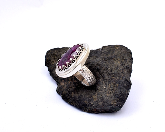 Ruby ring with textured slightly domed band